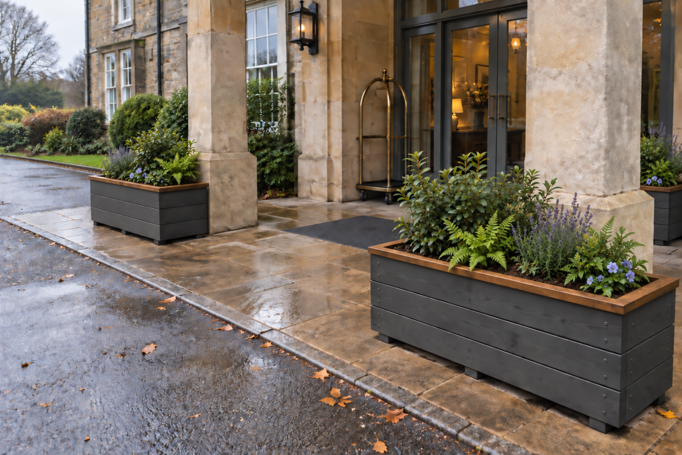 North Wales Planters Charcoal timber planters with dark oak lips at a hotel entrance